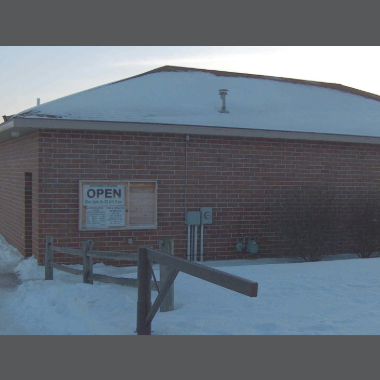 Rambling River Park Warming House with open sign and snow all around it