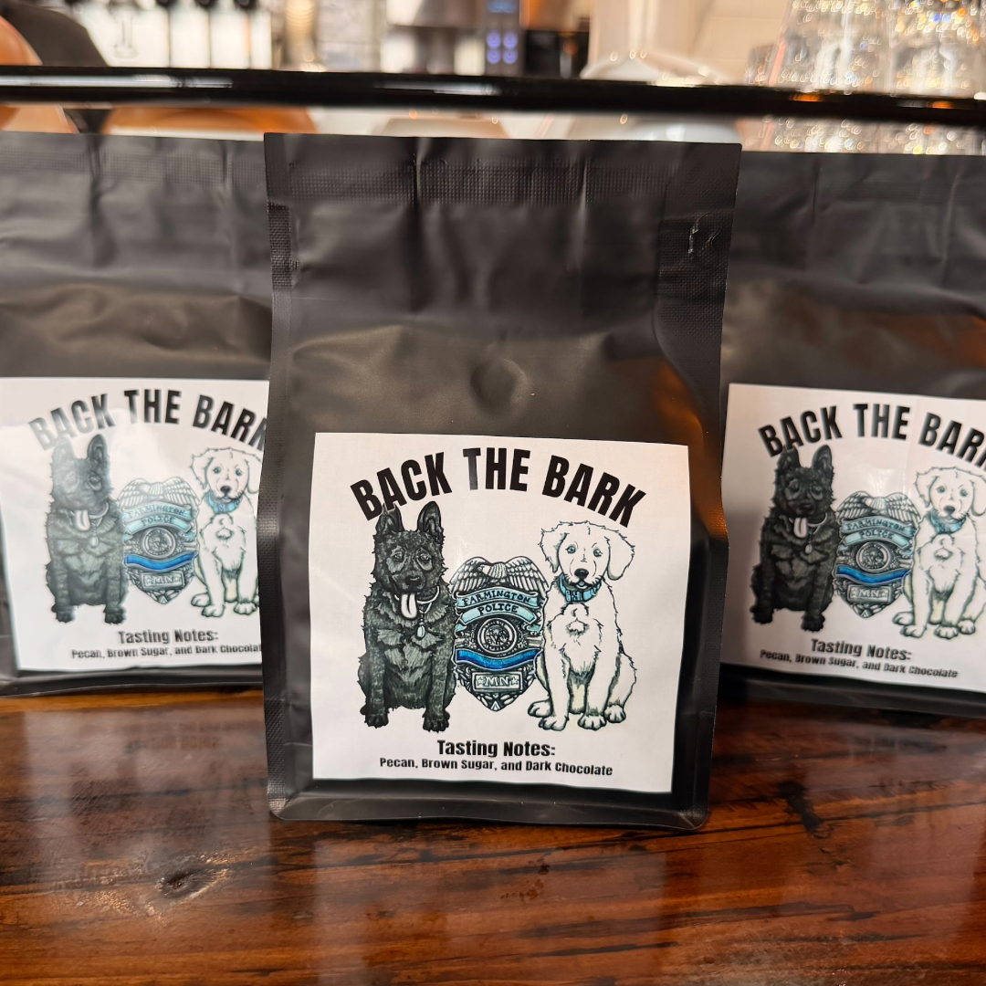 Back the Bark coffee bags with K-9s Smoke and Moose illustrations and the Farmington PD badge