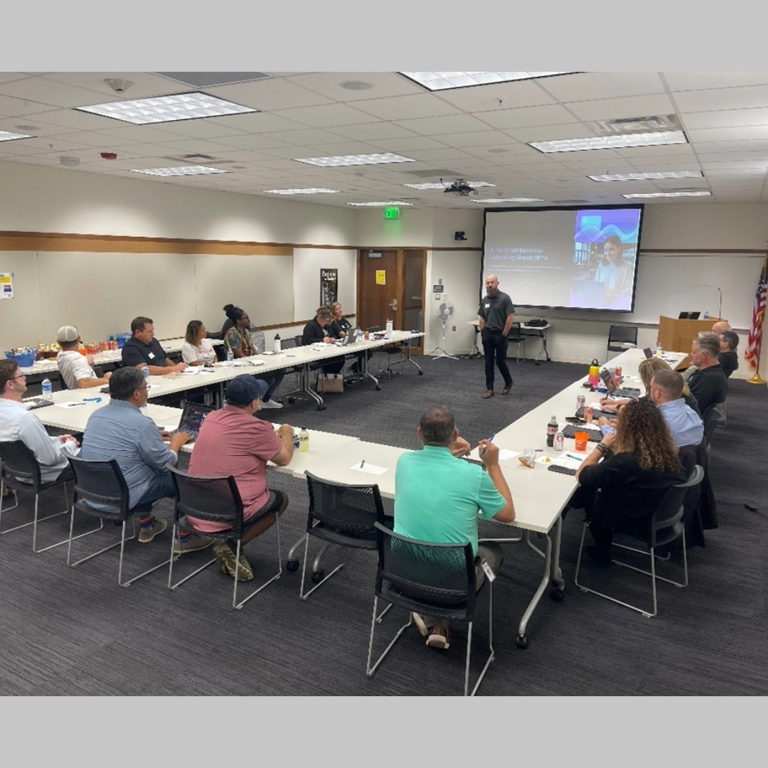 AI for Small Business group sitting at tables listening to a presentation at Farmington Library