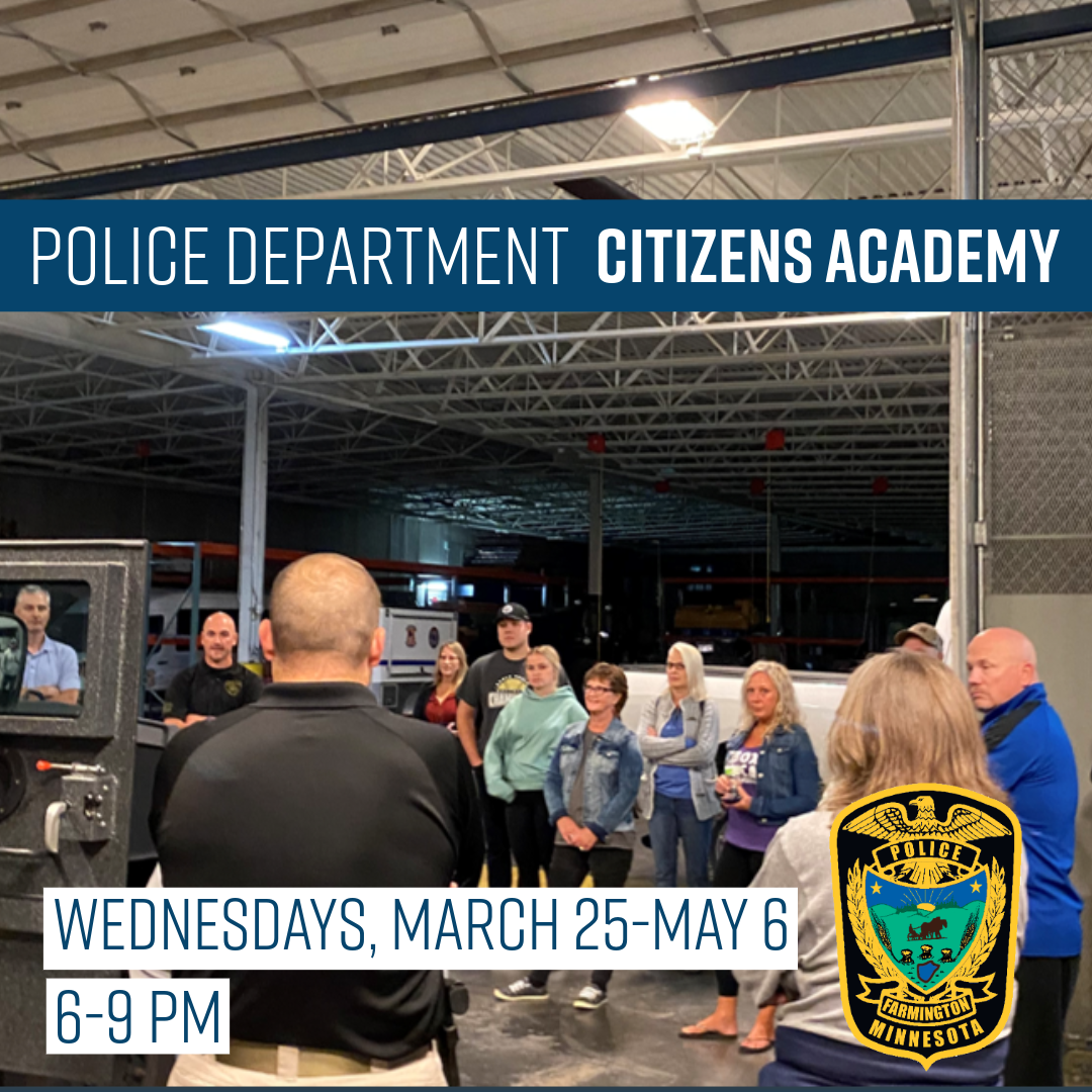 Citizens Police Academy group standing around a SWAT vehicle
