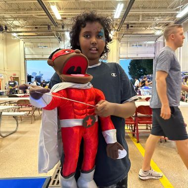 New puppet being held by girl